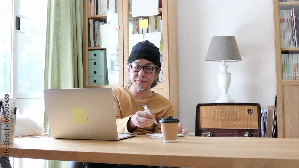 The Asian man working from home. The Asian man working from home.