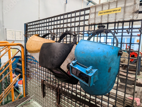 Protective Welding Helmets in Workshop Storage photo