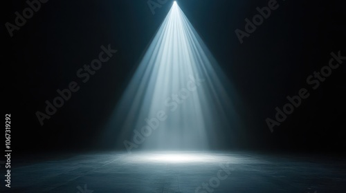 A single spotlight creating a tunnel of light through dense fog on an outdoor stage