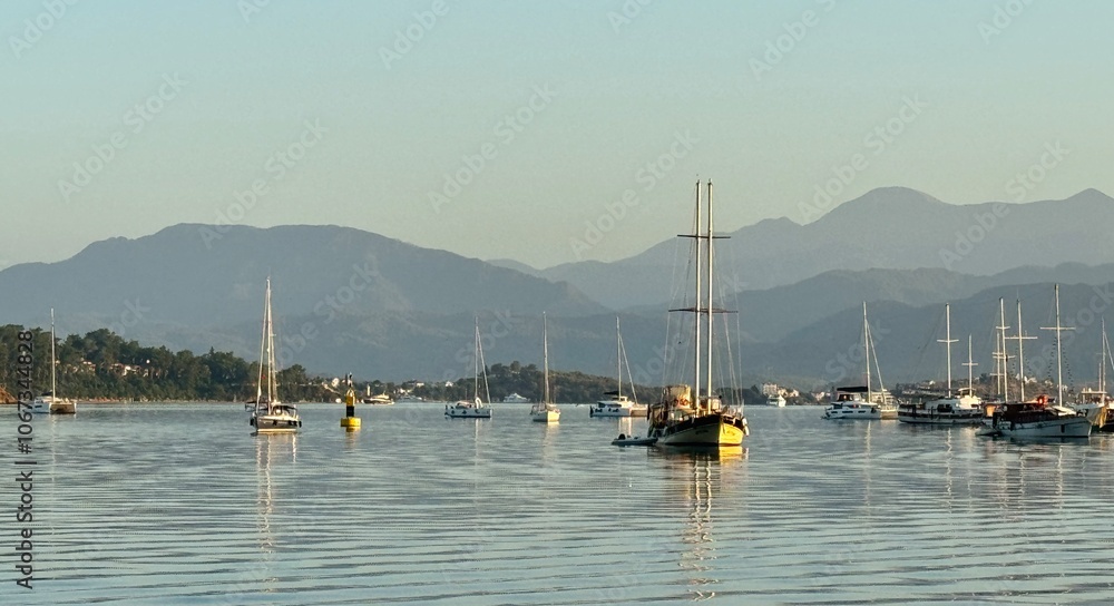 Sunrise at Fethiye Harbor with boats and yachts in Turkey