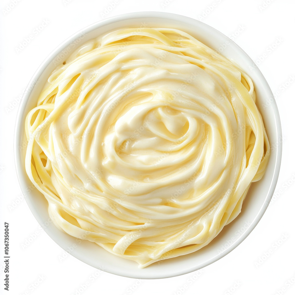 A plate of fettuccine pasta with alfredo sauce, isolated on a white background, highlighting a creamy Italian dish A plate of fettuccine pasta with alfredo sauce, isolated on a white background, highlighting a creamy Italian dish