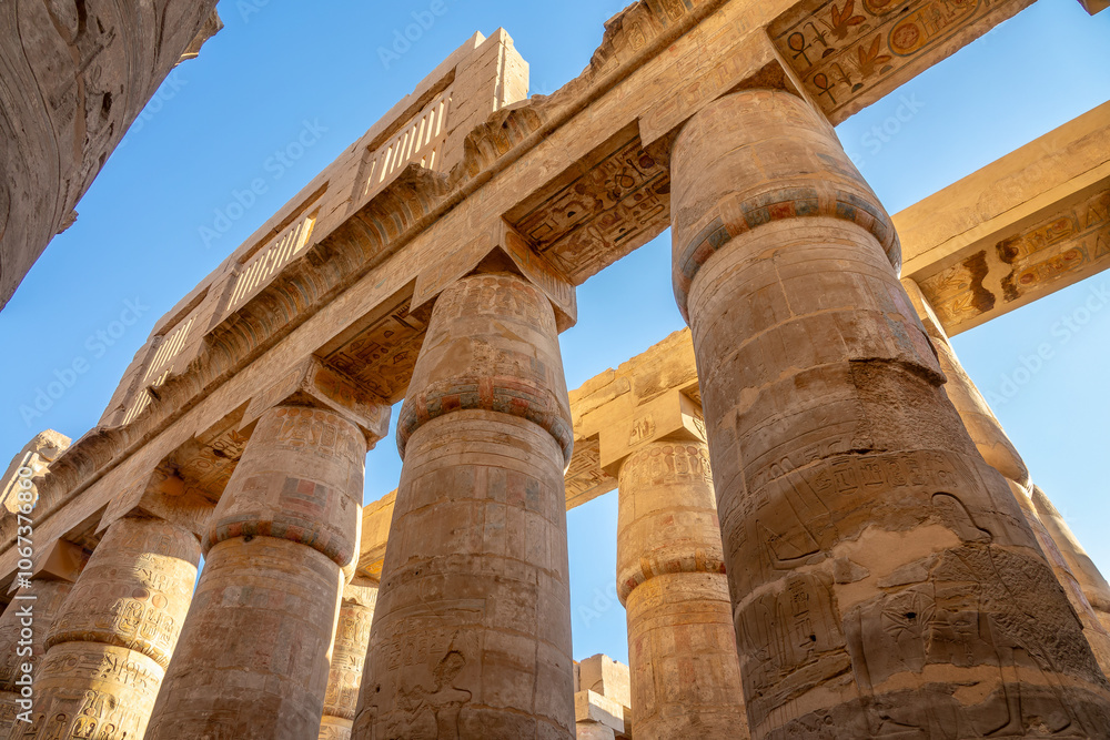 Hieroglyphs carved on columns, interior of Karnak temple in Luxor, Egypt
