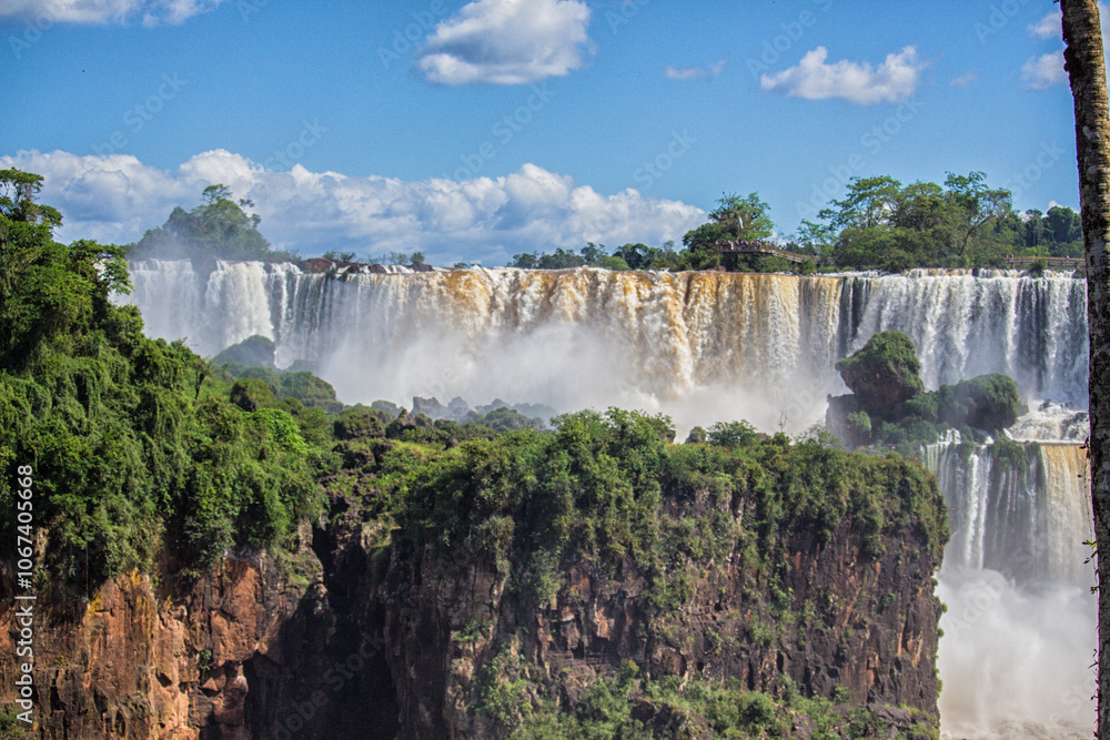 Fototapeta premium Panoramic view of Iguazu Falls on a sunny day, Misiones, Argentina