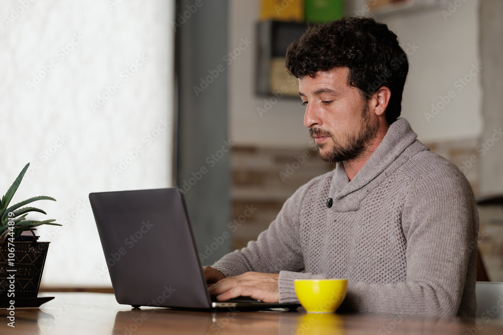 businessman working on his computer while drinking specialty coffee in the office businessman working on his computer while drinking specialty coffee in the office