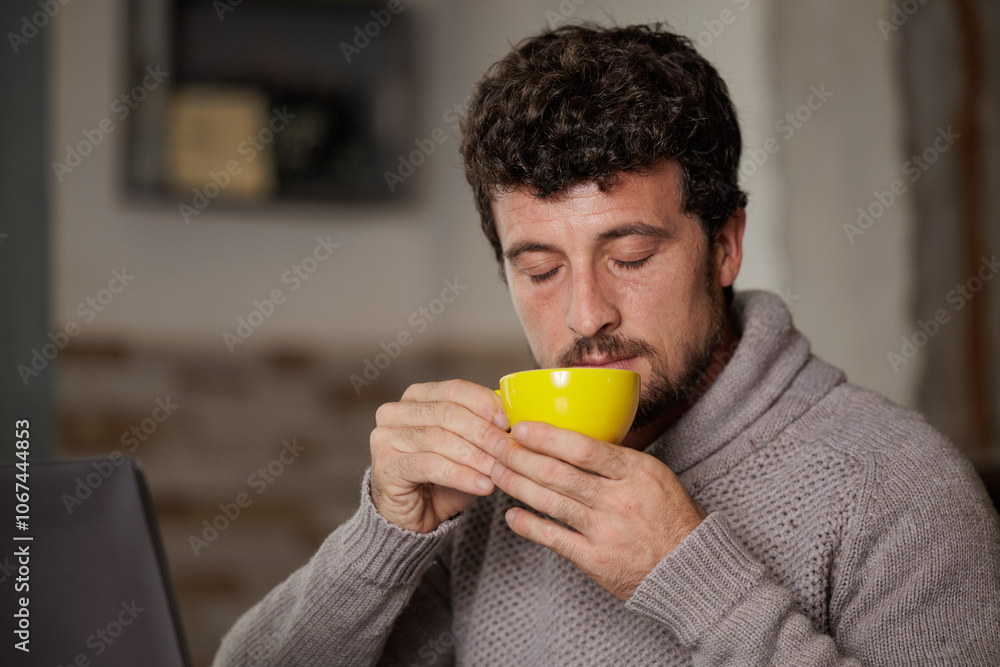 Man enjoying a cup of coffee on break from work. Man enjoying a cup of coffee on break from work.