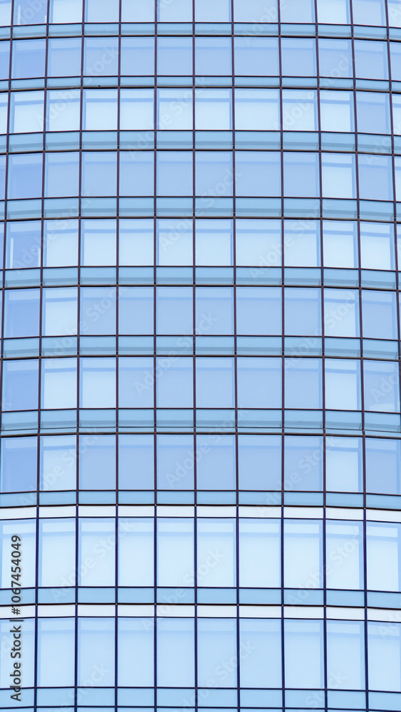 grid blue tinted windows on a modern building grid blue tinted windows on a modern building
