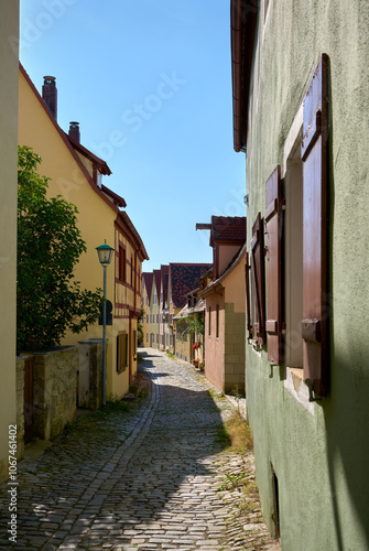 Colorful Narrow Alley Rothenburg ob der Tauber Germany. A narrow alley in the medieval heritage city of Rothenburg ob der Tauber, Germany.

 photo