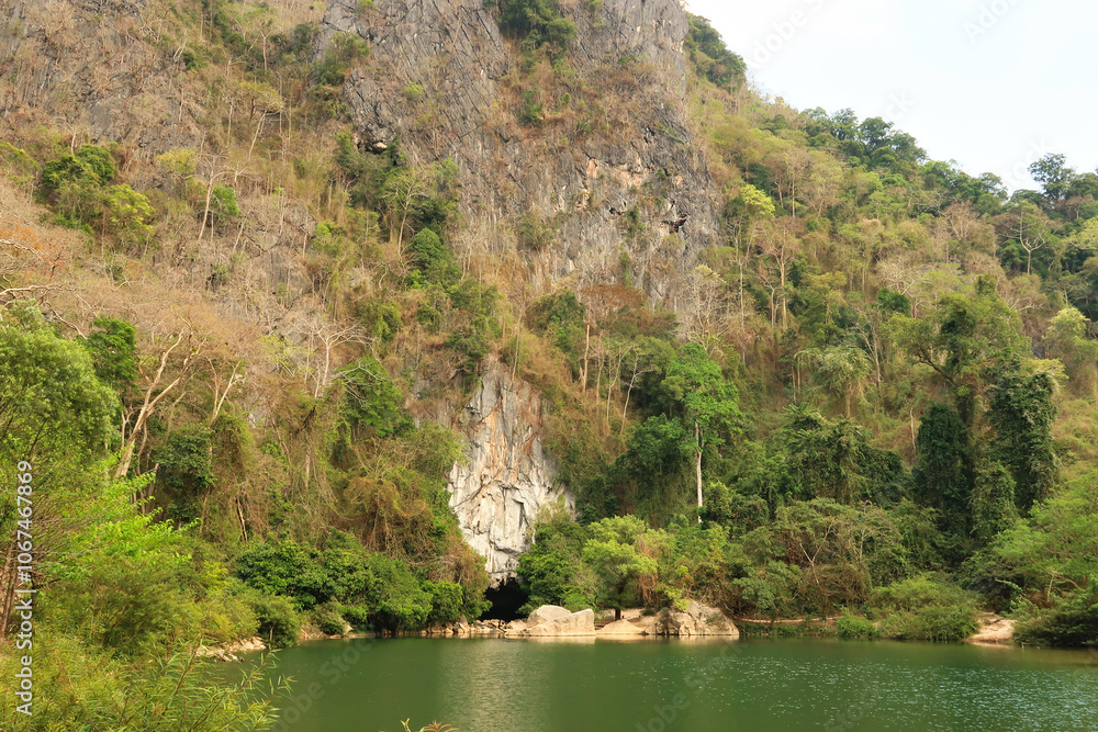 Spectacular view onto the entrance of the Kong Lor Cave, a tourist attraction on the Thakhek Motorbike Loop, Laos Spectacular view onto the entrance of the Kong Lor Cave, a tourist attraction on the Thakhek Motorbike Loop, Laos