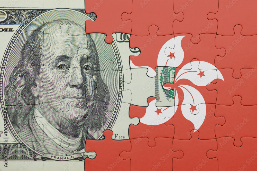 puzzle with the national flag of hong kong and the usa dollar money .finance concept