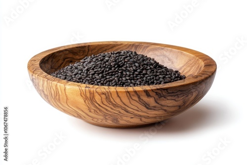 black rice in wooden bowl on white background photo