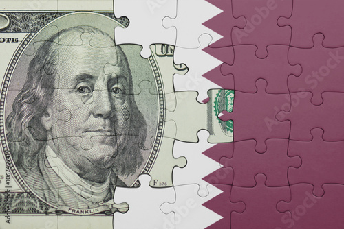 Wallpaper Mural puzzle with the national flag of qatar and the usa dollar money .finance concept Torontodigital.ca
