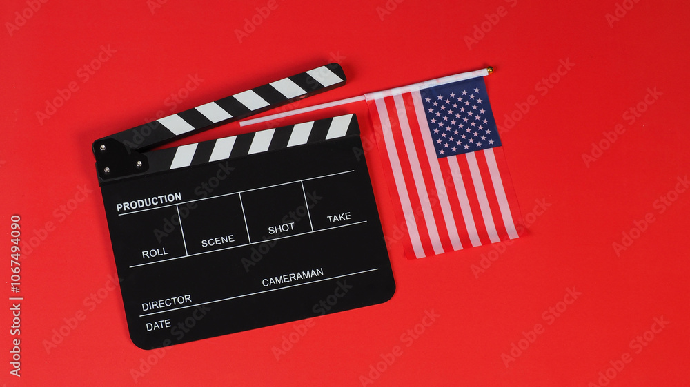 Naklejka premium American flag and Clapper board on red background.