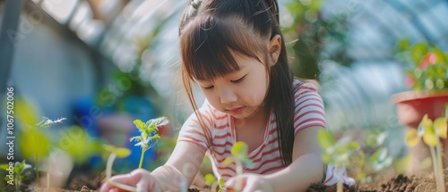 Budding Green Thumb: A Sweet Scene of a Little Girl Planting Seeds in the Greenhouse