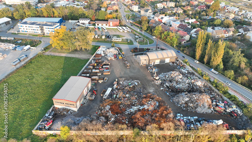 Recycling car scrap recycle station yard shop dump pile filled abandoned vehicles rusted metal mechanical waste claw arm dropping crushed breakers crane tongs removes trailer scrapyard rusty Europe