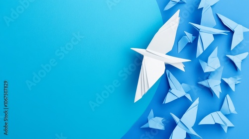 Creative Origami Birds in Flight Against a Vibrant Blue Background