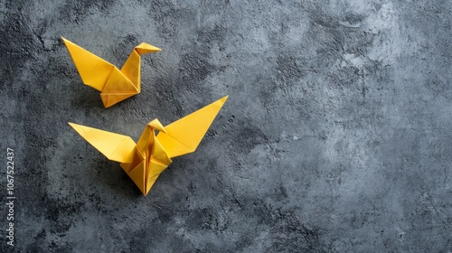 Yellow Origami Cranes on Gray Background