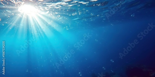 Underwater scene with bubbles rising from ocean floor as sunlight filters through the water, creating a mesmerizing display of sun rays, serene, tranquility, peaceful