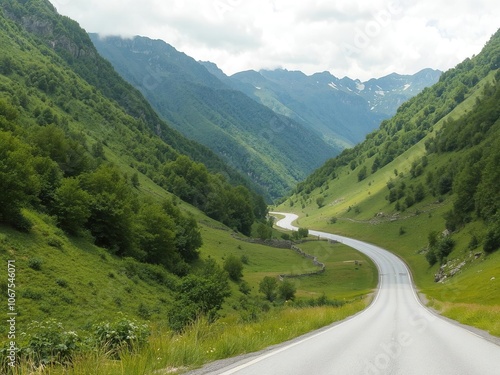 A scenic view of a long winding road stretching through a lush green landscape with mountains in the background, road, path