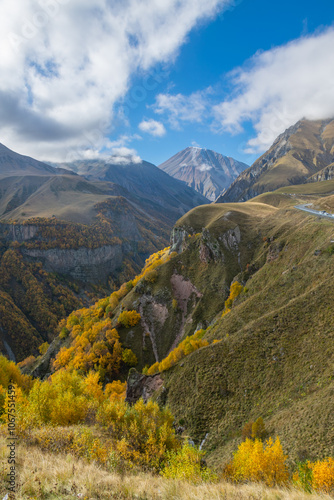 Landscape view, autumn in caucasus mountains, snow covered mountain peak in sunny day, Georgia, Gudauri