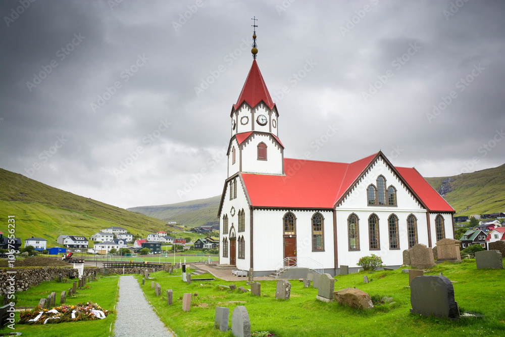 Distinctive red-roofed church in the town of Sandavágur in the Faroe Islands Distinctive red-roofed church in the town of Sandavágur in the Faroe Islands
