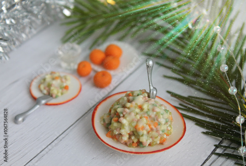 miniature food for dolls in the form of Christmas salad and tangerine. 