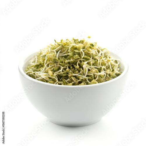 A bowl of fresh alfalfa sprouts, isolated on a white background, highlighting a healthy topping