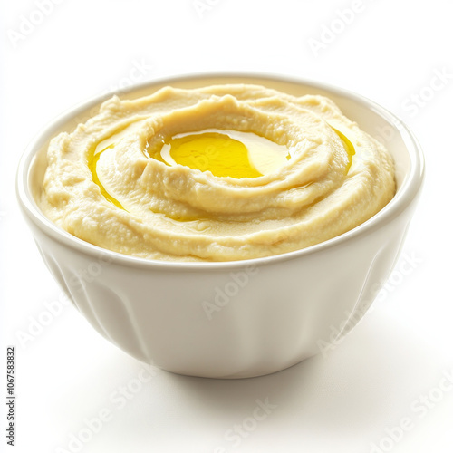 A bowl of creamy hummus with olive oil, isolated on a white background, highlighting a Mediterranean dip