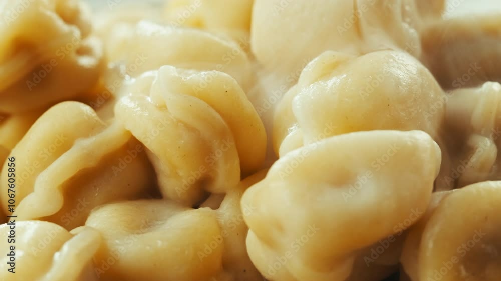 Dumplings in cafe, close up, Eating and serving Meat frozen dumplings in restaurant with mayo sour cream sauce, Ukranian, polish, Russian traditional pelmeni cooking process, vareniki ravioli pierogi Dumplings in cafe, close up, Eating and serving Meat frozen dumplings in restaurant with mayo sour cream sauce, Ukranian, polish, Russian traditional pelmeni cooking process, vareniki ravioli pierogi