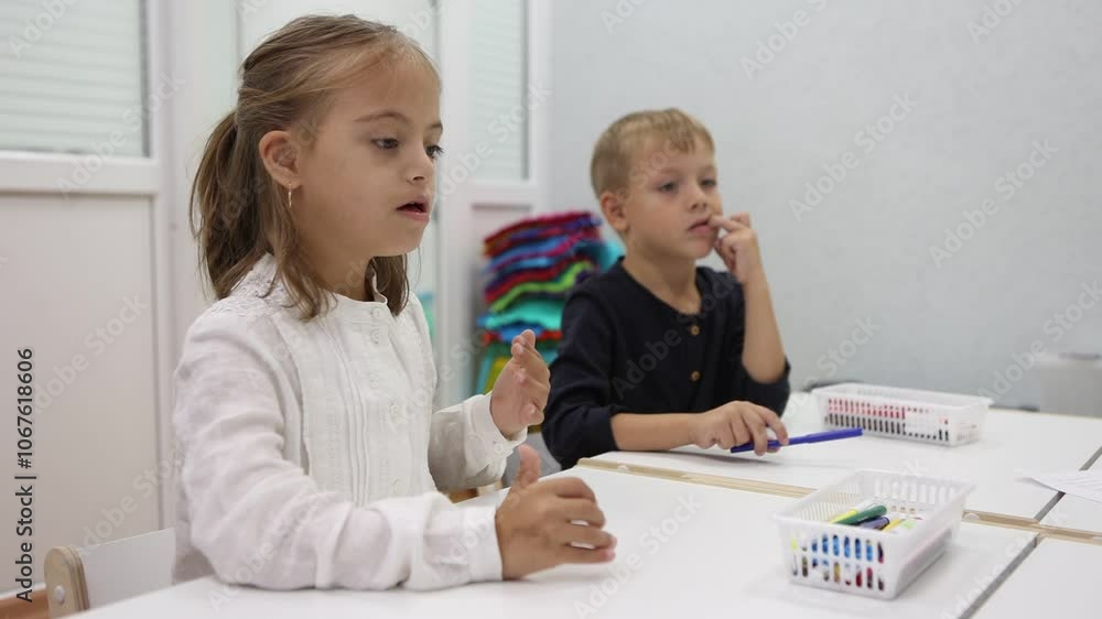 children with a teacher at a kindergarten class children with a teacher at a kindergarten class