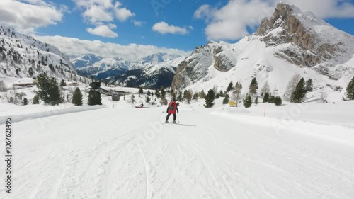 Male Skier ski on blue slope in Cortina Ski resort Dolomites, sunny