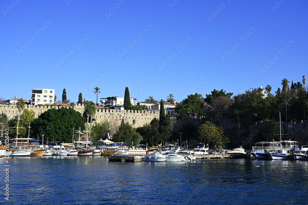 Obraz premium Antalya Kaleici Marina, sunset in the Mediterranean, view of the Taurus Mountains, boats