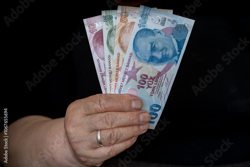 Turkish Lira in Hands of Elderly Retired Woman. Farmer woman and Turkish lira in hand