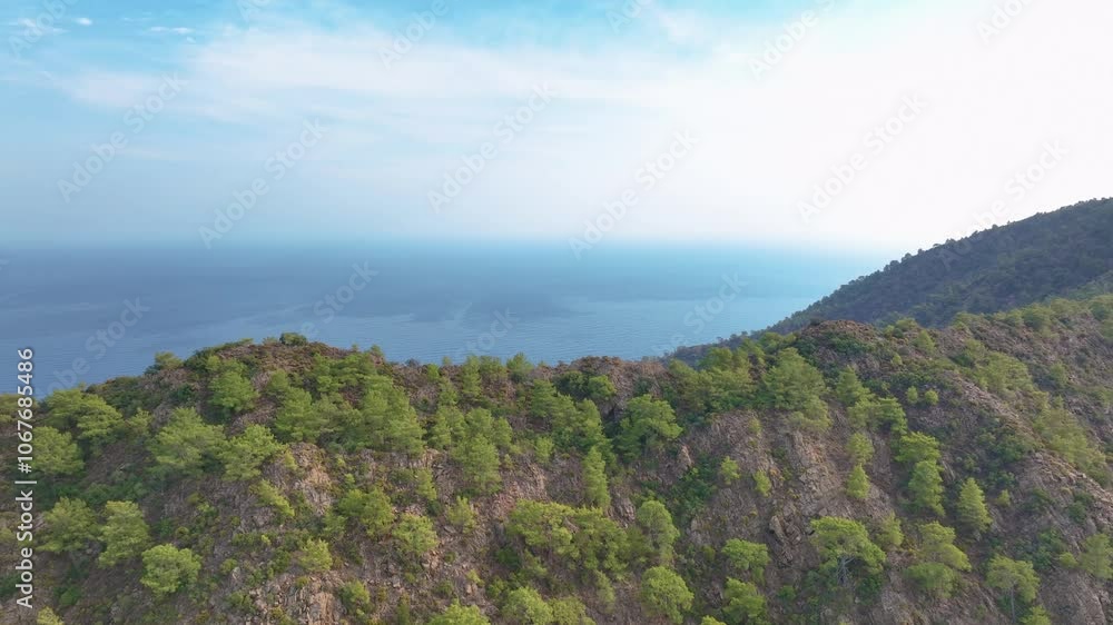 Camera slowly pans to the right, revealing a beautiful mediterranean coastline with turquoise waters and lush green trees Camera slowly pans to the right, revealing a beautiful mediterranean coastline with turquoise waters and lush green trees