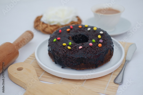 Chocolate cake on white plate with bamboo mat 