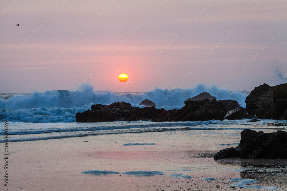 the sun as it dips towards the horizon, casting a warm orange and pink hue across the sky and reflecting onto the water the sun as it dips towards the horizon, casting a warm orange and pink hue across the sky and reflecting onto the water