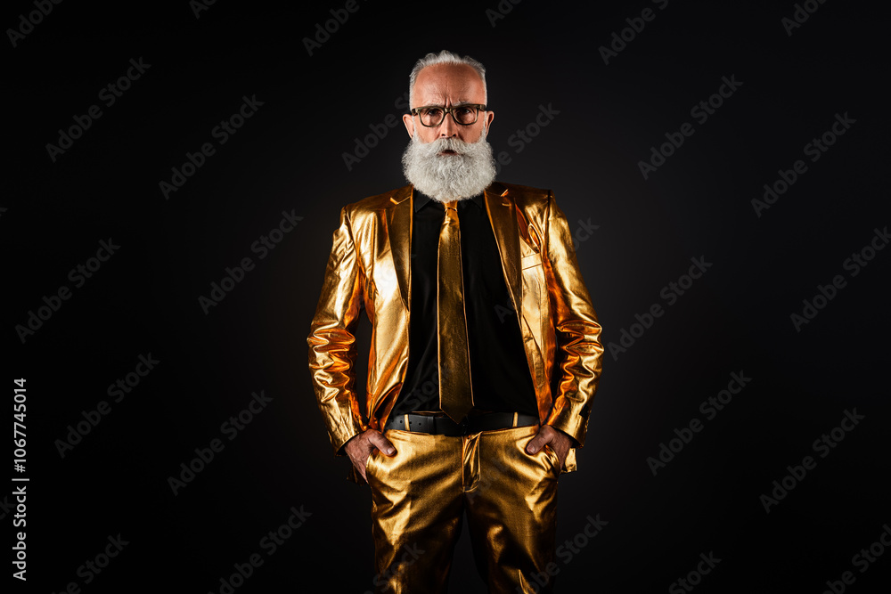 Photo of rich wealthy man millionaire standing hands pockets gold stylish suit trousers over dark color background Photo of rich wealthy man millionaire standing hands pockets gold stylish suit trousers over dark color background