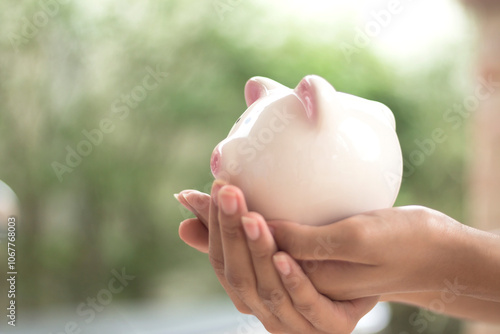 woman hand holding piggy bank empty space selective space