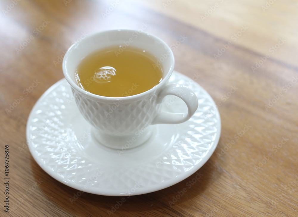 cup of tea on wooden table in coffee shop cup of tea on wooden table in coffee shop