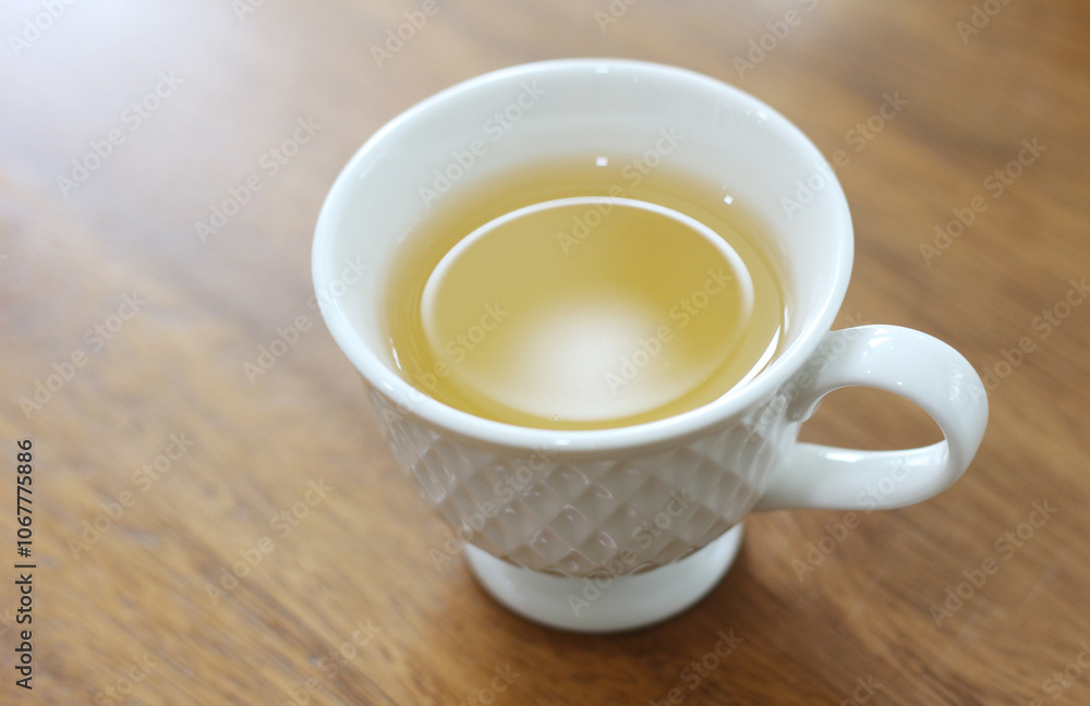 cup of tea on wooden table in coffee shop cup of tea on wooden table in coffee shop