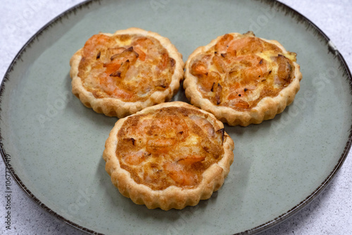 Seafood and bakery. Closeup view of three shrimp pies with gratin cheese