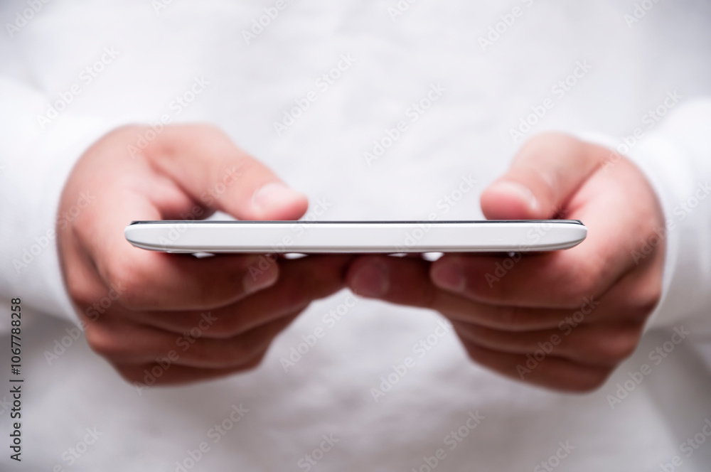 Close up view of young man holding a tablet outdoors Close up view of young man holding a tablet outdoors