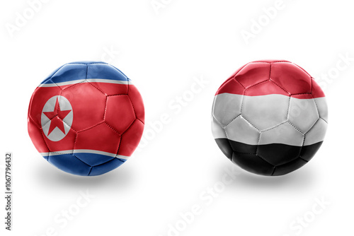 football balls with national flags of yemen and north korea ,soccer teams. on the white background. photo