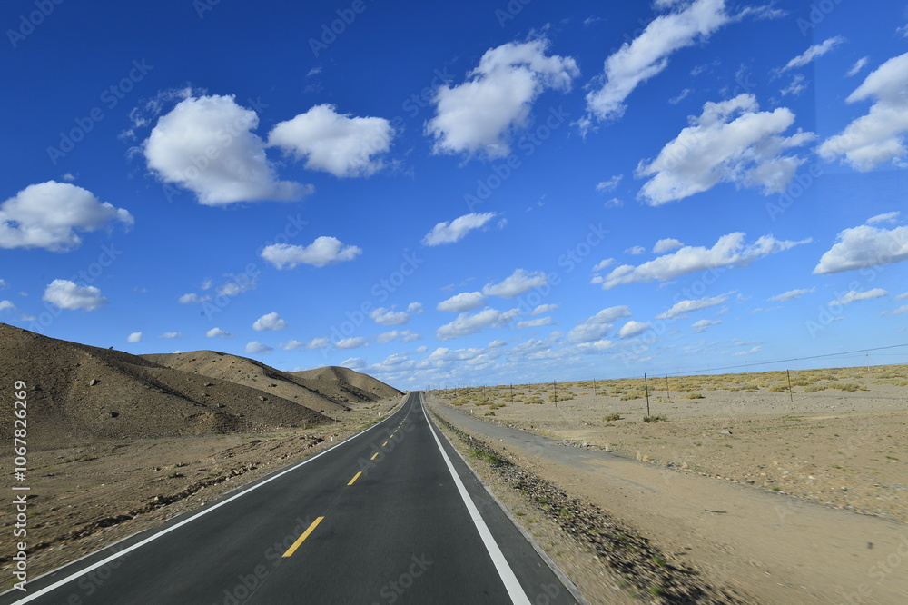 Desert road sand dunes in Xinjiang, China