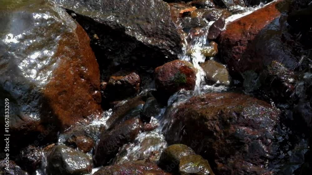 Clear water flows between the stones. Natural flowing stones and water. Natural springs. Looks clean and fresh.Footage 4K,60Fps Clear water flows between the stones. Natural flowing stones and water. Natural springs. Looks clean and fresh.Footage 4K,60Fps