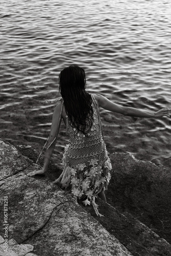 girl by the water in dress