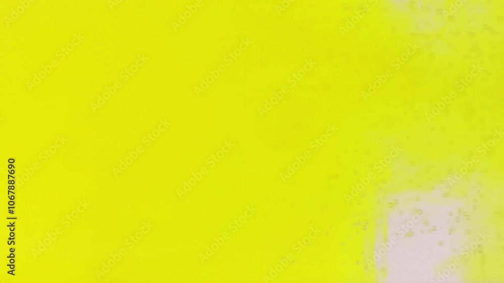 yellow color pouring into water on white background.
yellow color pouring into water on white background.