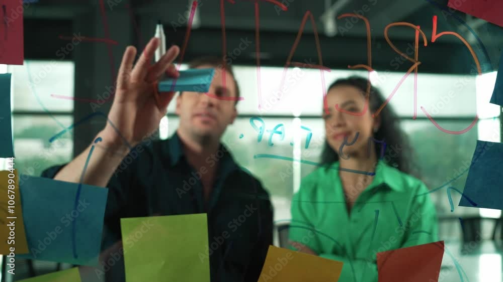 Skilled businessman presents marketing idea to project manager at glass wall. Manager explaining start up project to investor. Smart business team working together, brainstorming idea. Manipulator. Skilled businessman presents marketing idea to project manager at glass wall. Manager explaining start up project to investor. Smart business team working together, brainstorming idea. Manipulator.