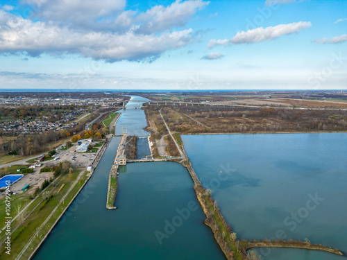 Aerial over the Welland Canal, part of the St. Lawrence Seaway and Great Lakes Waterway in St. Catharines, Ontario, Canada. Looking north towards lock 3 and Niagara-on-the-Lake and Lake Ontario. 