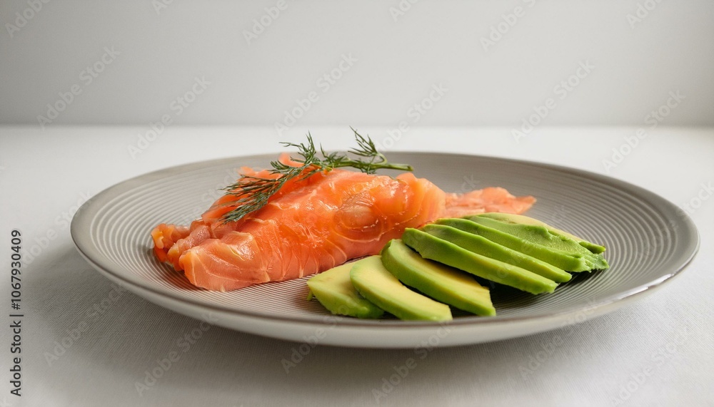 A plate of avocado and salmon slices A plate of avocado and salmon slices