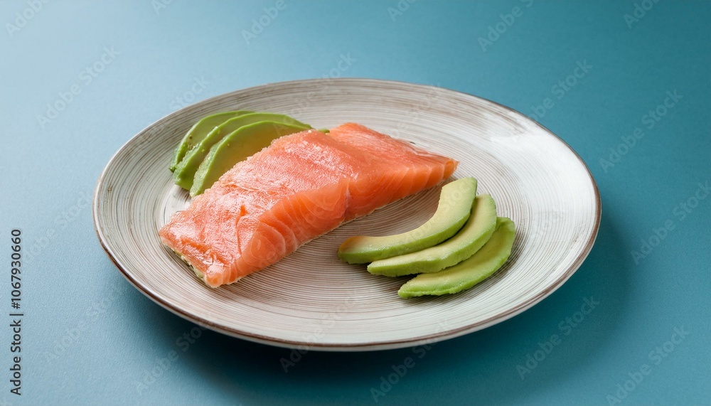 A plate of avocado and salmon slices A plate of avocado and salmon slices